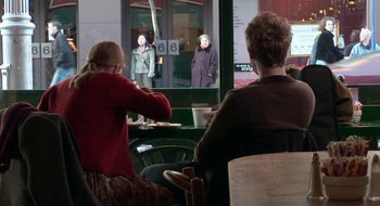 Movie still from “Once” (2007), directed by John Carney – Two people sitting in front of a window; Medium shot, Over the shoulder angle
