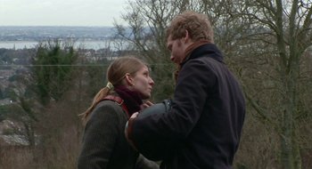 Movie still from “Once” (2007), directed by John Carney – A man and a woman standing next to each other; Medium shot, Over the shoulder angle