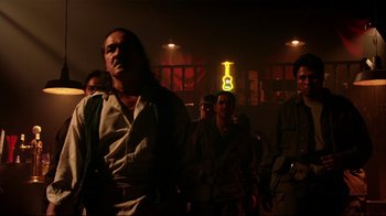 Movie still from “Once Upon a Time in Mexico” (2003), directed by Robert Rodriguez – A group of people standing in a room; Medium shot, Low angle