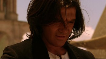 Movie still from “Once Upon a Time in Mexico” (2003), directed by Robert Rodriguez – A person with long black hair; Close Up shot, Over the shoulder angle
