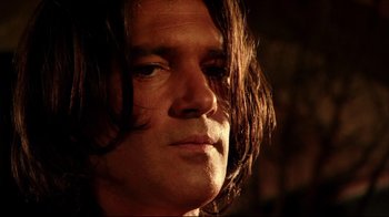 Movie still from “Once Upon a Time in Mexico” (2003), directed by Robert Rodriguez – A person with long hair; Close Up shot, Low angle