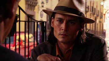 Movie still from “Once Upon a Time in Mexico” (2003), directed by Robert Rodriguez – A person wearing a hat; Close Up shot, Low angle