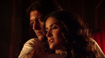 Movie still from “Once Upon a Time in Mexico” (2003), directed by Robert Rodriguez – A man and a woman embracing each other in the dark; Close Up shot, Low angle