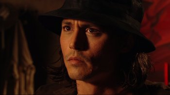 Movie still from “Once Upon a Time in Mexico” (2003), directed by Robert Rodriguez – A person wearing a hat; Close Up shot, High angle
