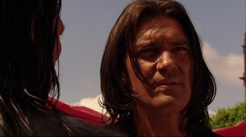 Movie still from “Once Upon a Time in Mexico” (2003), directed by Robert Rodriguez – A person with long black hair; Close Up shot, Over the shoulder angle
