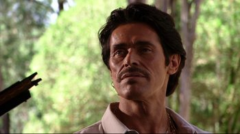 Movie still from “Once Upon a Time in Mexico” (2003), directed by Robert Rodriguez – A person with a beard and mustache; Close Up shot, Low angle