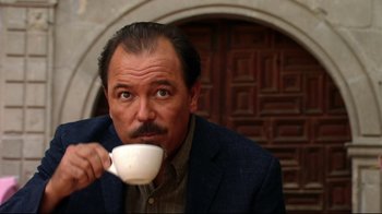 Movie still from “Once Upon a Time in Mexico” (2003), directed by Robert Rodriguez – A person drinking a cup of coffee; Close Up shot, Low angle