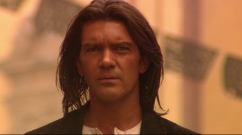 Movie still from “Once Upon a Time in Mexico” (2003), directed by Robert Rodriguez – A person with long brown hair; Close Up shot, Low angle