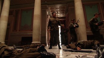 Movie still from “Once Upon a Time in Mexico” (2003), directed by Robert Rodriguez – A group of men in uniforms in a hallway; Wide shot, Low angle