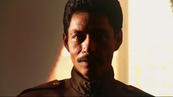 Movie still from “Once Upon a Time in Mexico” (2003), directed by Robert Rodriguez – A person wearing a military uniform; Close Up shot, Low angle