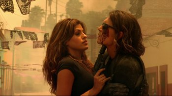 Movie still from “Once Upon a Time in Mexico” (2003), directed by Robert Rodriguez – A man and a woman holding a gun in their hands; Close Up shot, Overhead angle