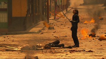 Movie still from “Once Upon a Time in Mexico” (2003), directed by Robert Rodriguez – A man standing in the middle of a street; Wide shot, Low angle