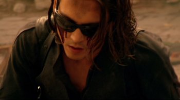 Movie still from “Once Upon a Time in Mexico” (2003), directed by Robert Rodriguez – A person wearing sunglasses; Close Up shot, High angle
