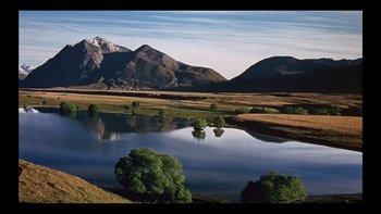 Movie still from “Once Were Warriors” (1994), directed by Lee Tamahori – A large body of water in the middle of a field; Extreme Wide shot, High angle