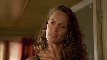 Movie still from “Once Were Warriors” (1994), directed by Lee Tamahori – A person with curly hair; Close Up shot, Low angle