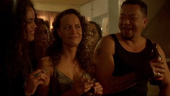 Movie still from “Once Were Warriors” (1994), directed by Lee Tamahori – A group of people standing in a room; Close Up shot, Over the shoulder angle