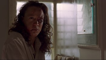 Movie still from “Once Were Warriors” (1994), directed by Lee Tamahori – A woman with a bruised eye stares at the camera; Close Up shot, Low angle