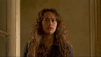 Movie still from “Once Were Warriors” (1994), directed by Lee Tamahori – A woman with long hair is looking at the camera; Close Up shot, Over the shoulder angle