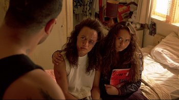 Movie still from “Once Were Warriors” (1994), directed by Lee Tamahori – Two women sitting next to each other in front of a mirror; Medium shot, Over the shoulder angle