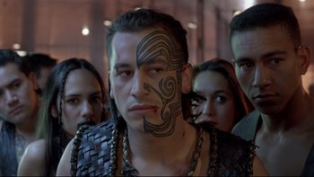 Movie still from “Once Were Warriors” (1994), directed by Lee Tamahori – A group of people standing next to each other; Close Up shot, Over the shoulder angle