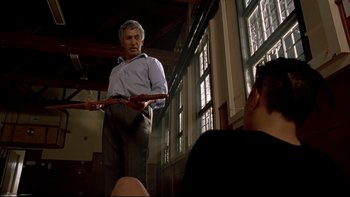 Movie still from “Once Were Warriors” (1994), directed by Lee Tamahori – An older man standing in front of a group of people; Medium shot, Low angle