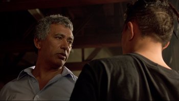 Movie still from “Once Were Warriors” (1994), directed by Lee Tamahori – Two men talking to each other in front of a wooden ceiling; Close Up shot, Over the shoulder angle