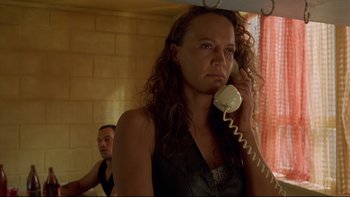 Movie still from “Once Were Warriors” (1994), directed by Lee Tamahori – A woman holding a phone up to her ear; Close Up shot, Low angle