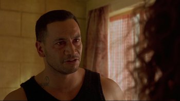 Movie still from “Once Were Warriors” (1994), directed by Lee Tamahori – A person wearing a black shirt; Close Up shot, Over the shoulder angle