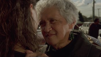 Movie still from “Once Were Warriors” (1994), directed by Lee Tamahori – An older woman is looking at a younger woman's hair; Close Up shot, Over the shoulder angle