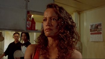 Movie still from “Once Were Warriors” (1994), directed by Lee Tamahori – A person with curly hair; Close Up shot, Low angle