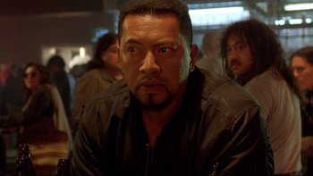 Movie still from “Once Were Warriors” (1994), directed by Lee Tamahori – A person wearing a black jacket; Close Up shot, Over the shoulder angle