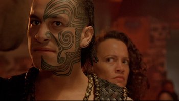 Movie still from “Once Were Warriors” (1994), directed by Lee Tamahori – A man and a woman with tattoos on their faces; Close Up shot, Over the shoulder angle