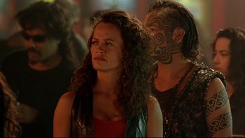 Movie still from “Once Were Warriors” (1994), directed by Lee Tamahori – A woman and a man with face tattoos; Close Up shot, Over the shoulder angle