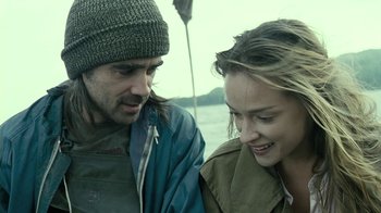 Movie still from “Ondine” (2009), directed by Neil Jordan – A man and a woman standing next to each other on a boat; Close Up shot, Over the shoulder angle