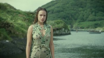 Movie still from “Ondine” (2009), directed by Neil Jordan – A woman standing in front of a body of water; Medium shot, Low angle