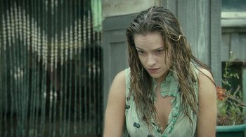 Movie still from “Ondine” (2009), directed by Neil Jordan – A woman with wet hair and a green shirt; Close Up shot, Over the shoulder angle