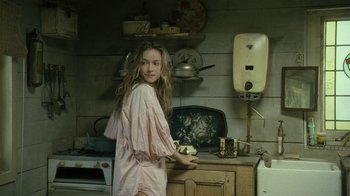 Movie still from “Ondine” (2009), directed by Neil Jordan – A woman standing in front of an oven in a kitchen; Medium shot, Low angle