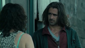 Movie still from “Ondine” (2009), directed by Neil Jordan – A man with long hair talking to a woman; Close Up shot, Over the shoulder angle