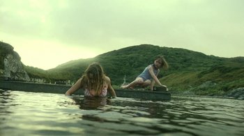 Movie still from “Ondine” (2009), directed by Neil Jordan – Two girls are swimming in a body of water; Wide shot, Low angle