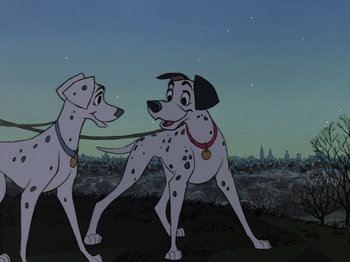 Movie still from “One Hundred and One Dalmatians” (1961), directed by Wolfgang Reitherman – Two dalmatian dogs standing next to each other on a field; Wide shot, Low angle