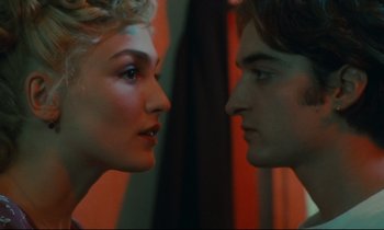 Movie still from “One Hundred and One Nights” (1995), directed by Agnès Varda – A man and a woman looking at each other in front of a mirror; Close Up shot, Over the shoulder angle