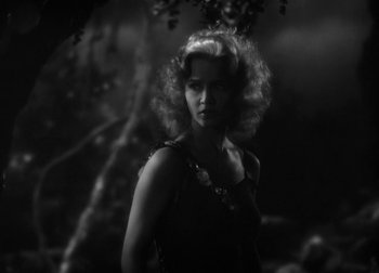 Movie still from “One Million B.C.” (1940), directed by Hal Roach Jr. – A black - and - white photo of a woman with curly hair; Close Up shot, Over the shoulder angle