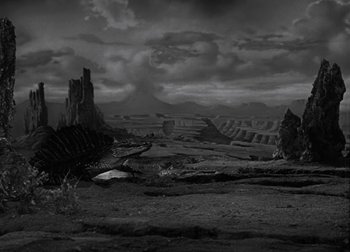 Movie still from “One Million B.C.” (1940), directed by Hal Roach Jr. – A black - and - white photo of a desert landscape; Extreme Wide shot, High angle
