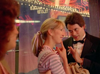 Movie still from “One from the Heart” (1981), directed by Francis Ford Coppola – A man and a woman talking to each other; Medium shot, Over the shoulder angle