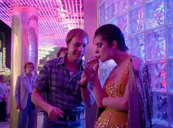 Movie still from “One from the Heart” (1981), directed by Francis Ford Coppola – A man and a woman are eating a cake together; Medium shot, Over the shoulder angle