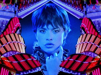 Movie still from “One from the Heart” (1981), directed by Francis Ford Coppola – A woman's face in a neon frame; Close Up shot, Low angle