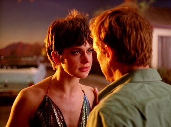 Movie still from “One from the Heart” (1981), directed by Francis Ford Coppola – A man and a woman standing next to each other on the street; Close Up shot, Over the shoulder angle