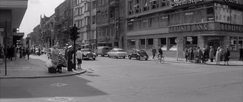 Movie still from “One, Two, Three” (1961), directed by Billy Wilder – A black and white photo of a city street; Wide shot, High angle