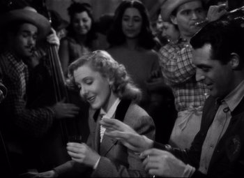 Movie still from “Only Angels Have Wings” (1939), directed by Howard Hawks – An old black and white photo of a group of people; Medium shot, High angle