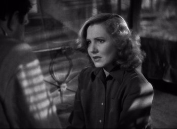 Movie still from “Only Angels Have Wings” (1939), directed by Howard Hawks – A black - and - white photo of a woman with long hair; Close Up shot, High angle